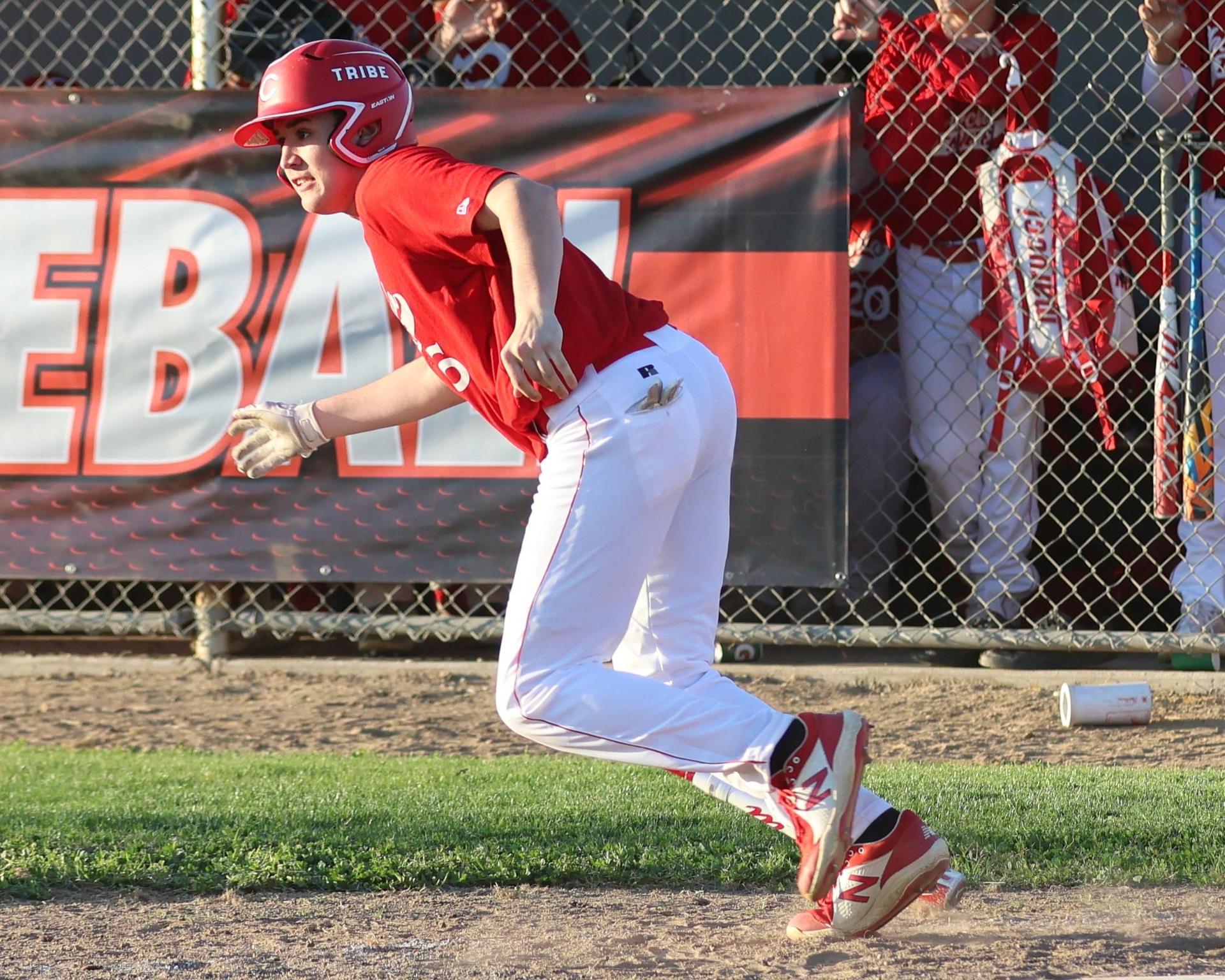 junior varsity baseball players in action