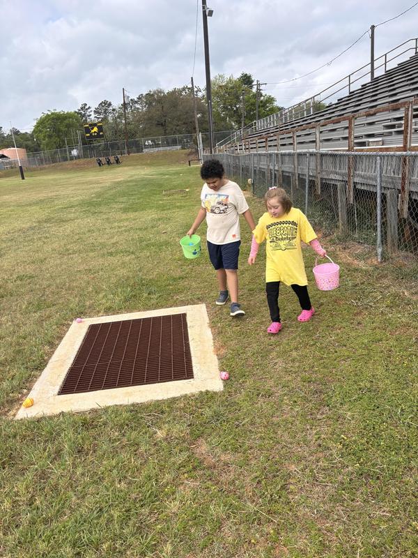 Life Skills kids hunting Easter eggs.