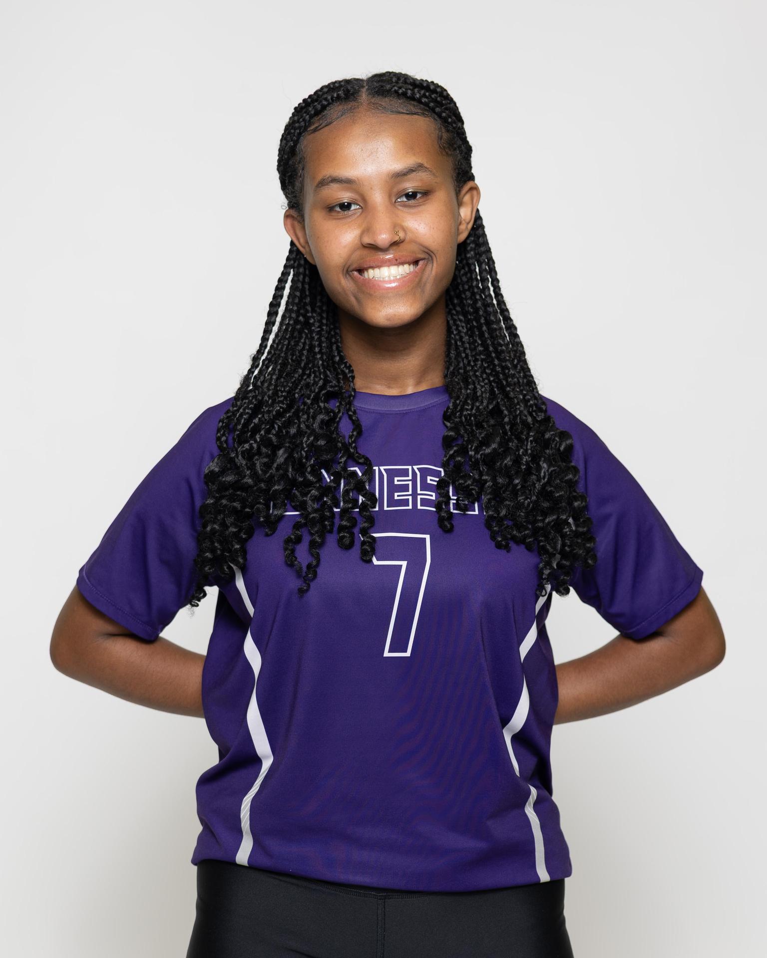 number 8 female volleyball player posing 