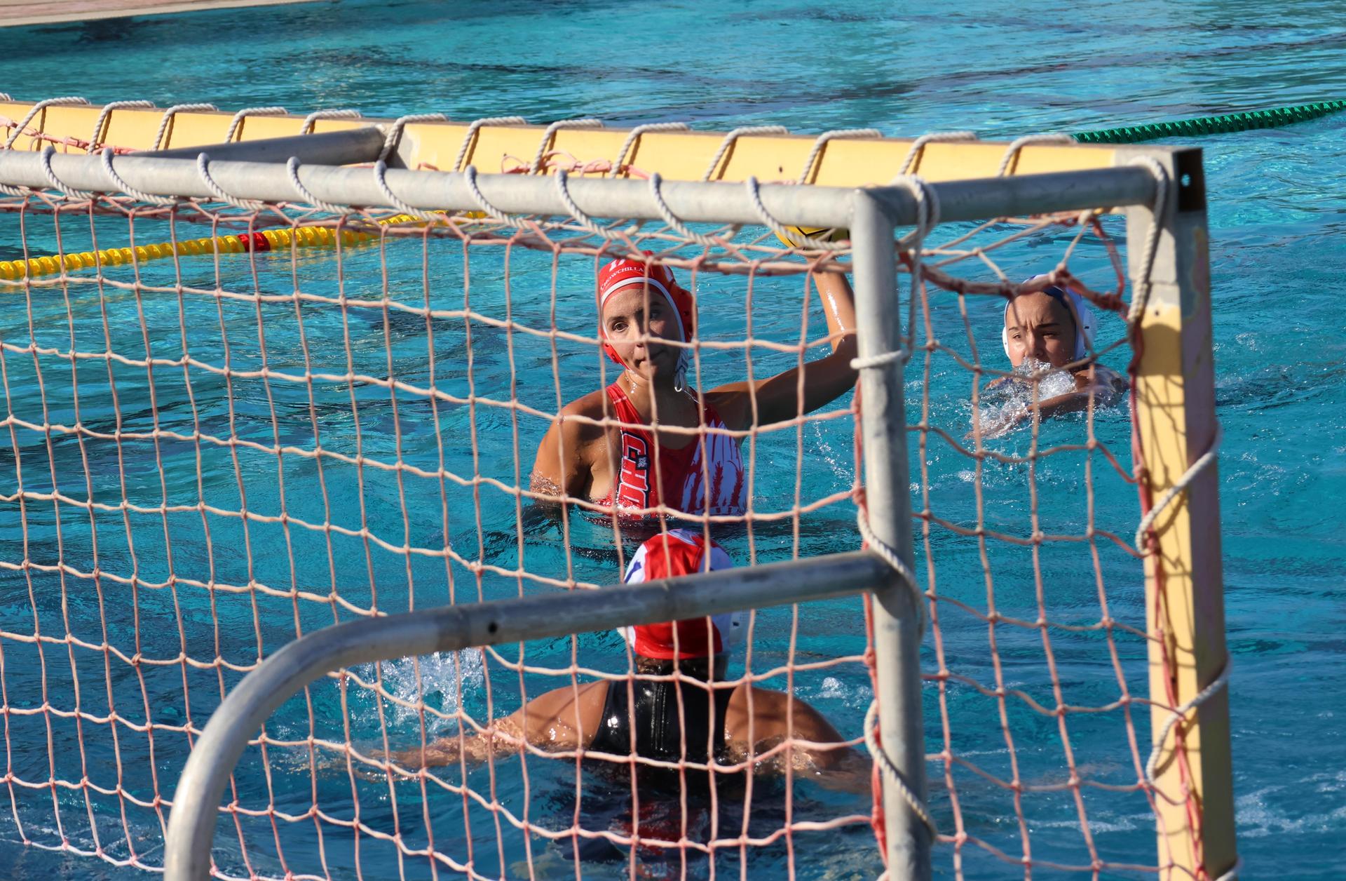 girls playing water polo against Sanger West