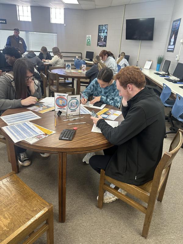 Students thinking, working on their form