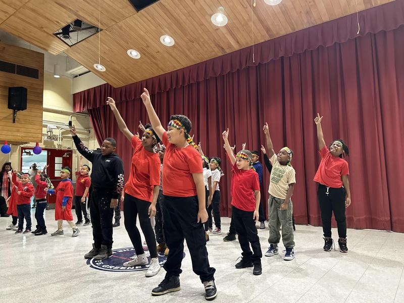 Fifth graders, dancing, and singing to songs from multiple cultures