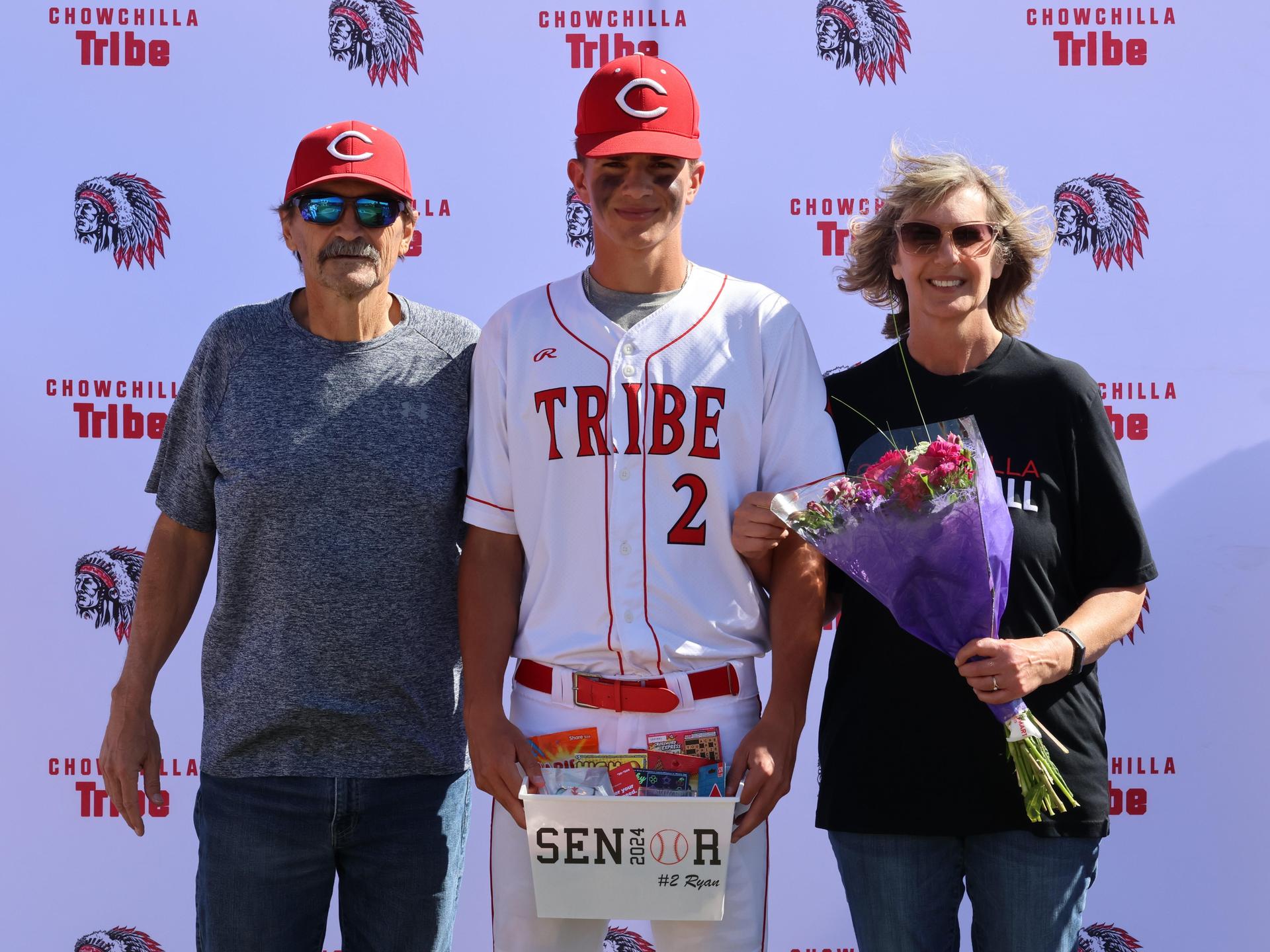 Seniors Posing With Teammates, Coaches, And Family