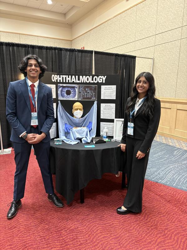 Smiling teens dressed in professional attire