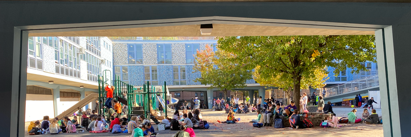 Lower Grasdes students enjoy lunch in the NEST+m Courtyard.