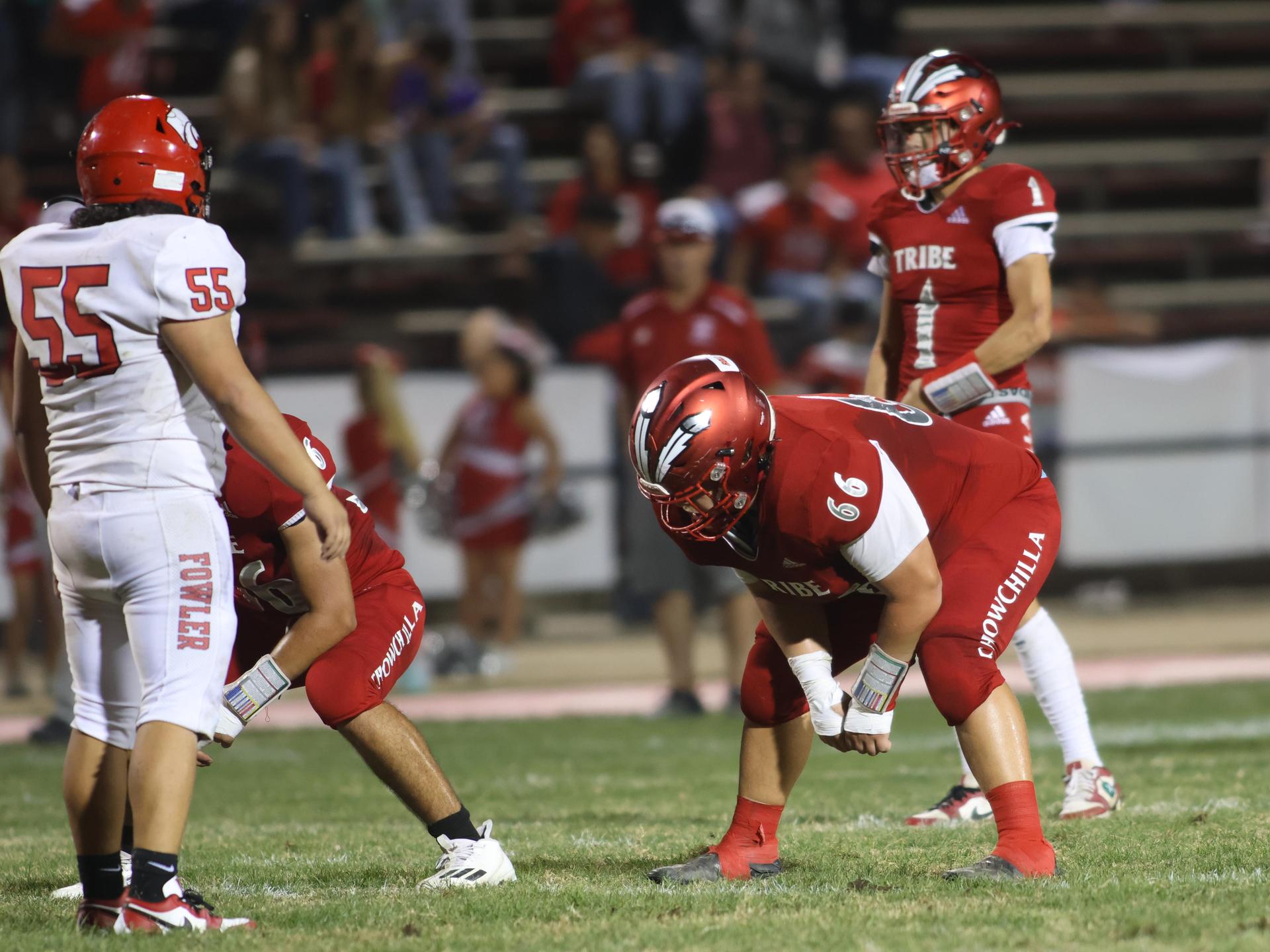 varsity boys playing football against Fowler