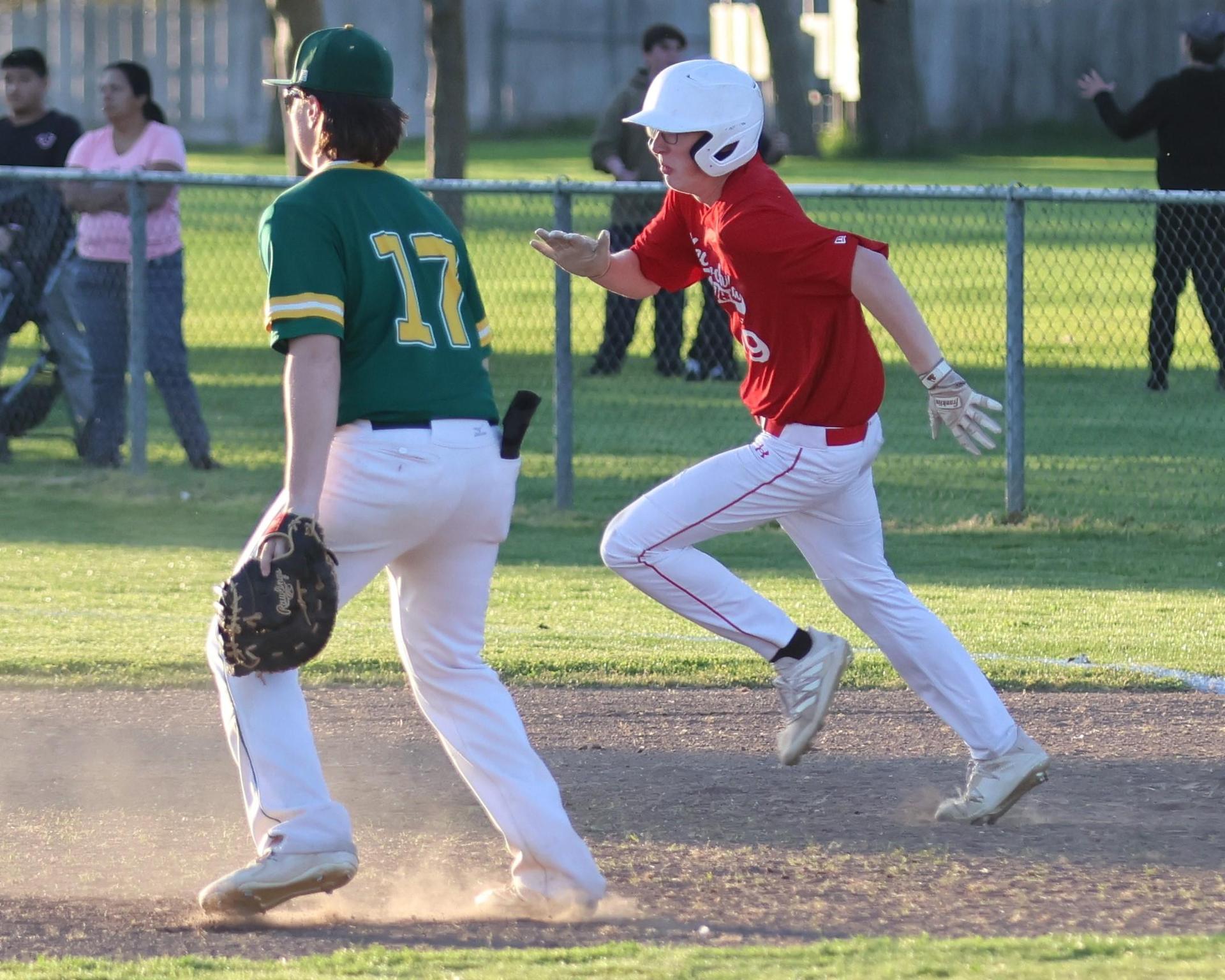 junior varsity baseball players in action