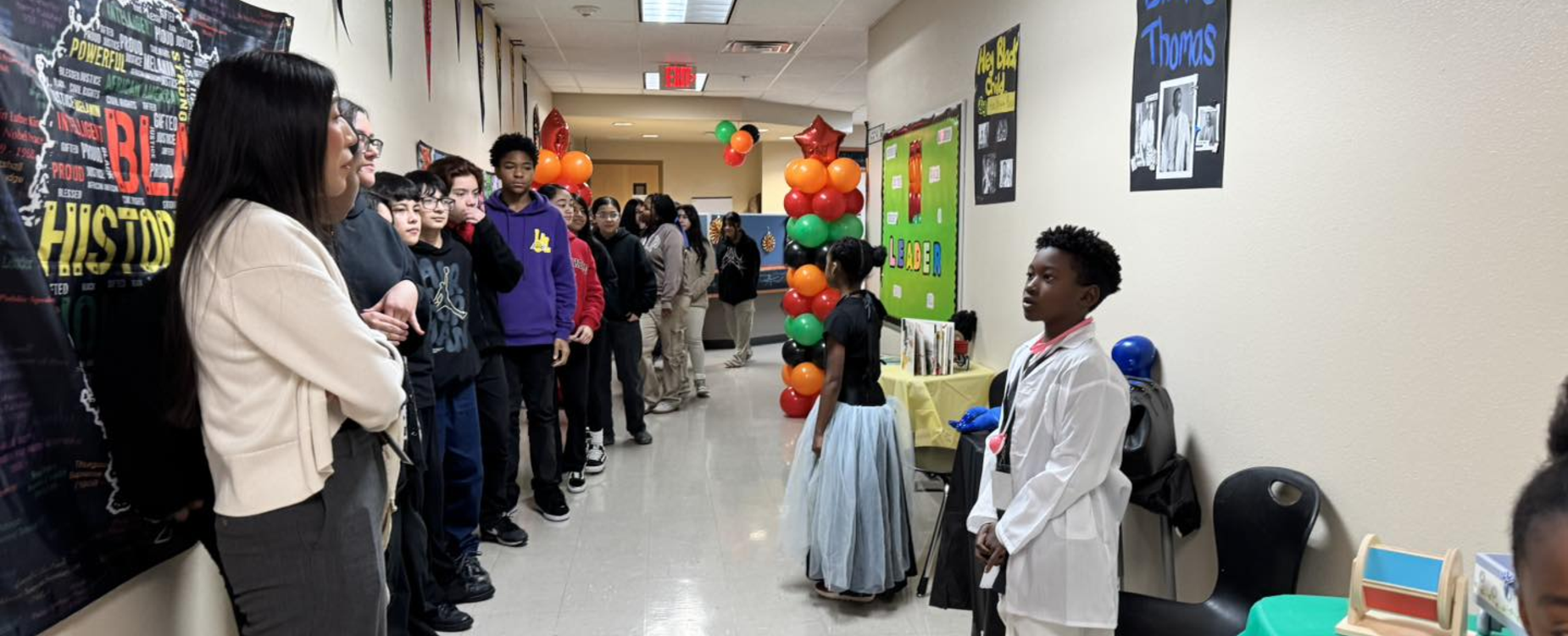 students presenting their subject in front of a group