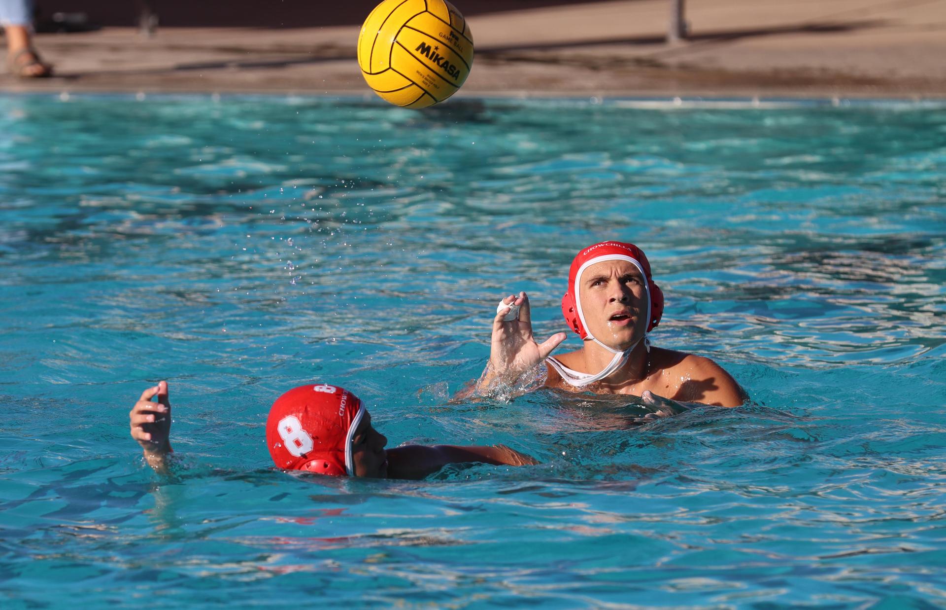 boys water polo players in action against san joaquin memorial