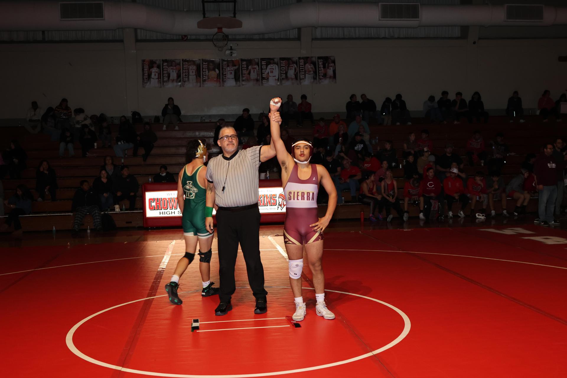 Wrestling winners with hands up 67