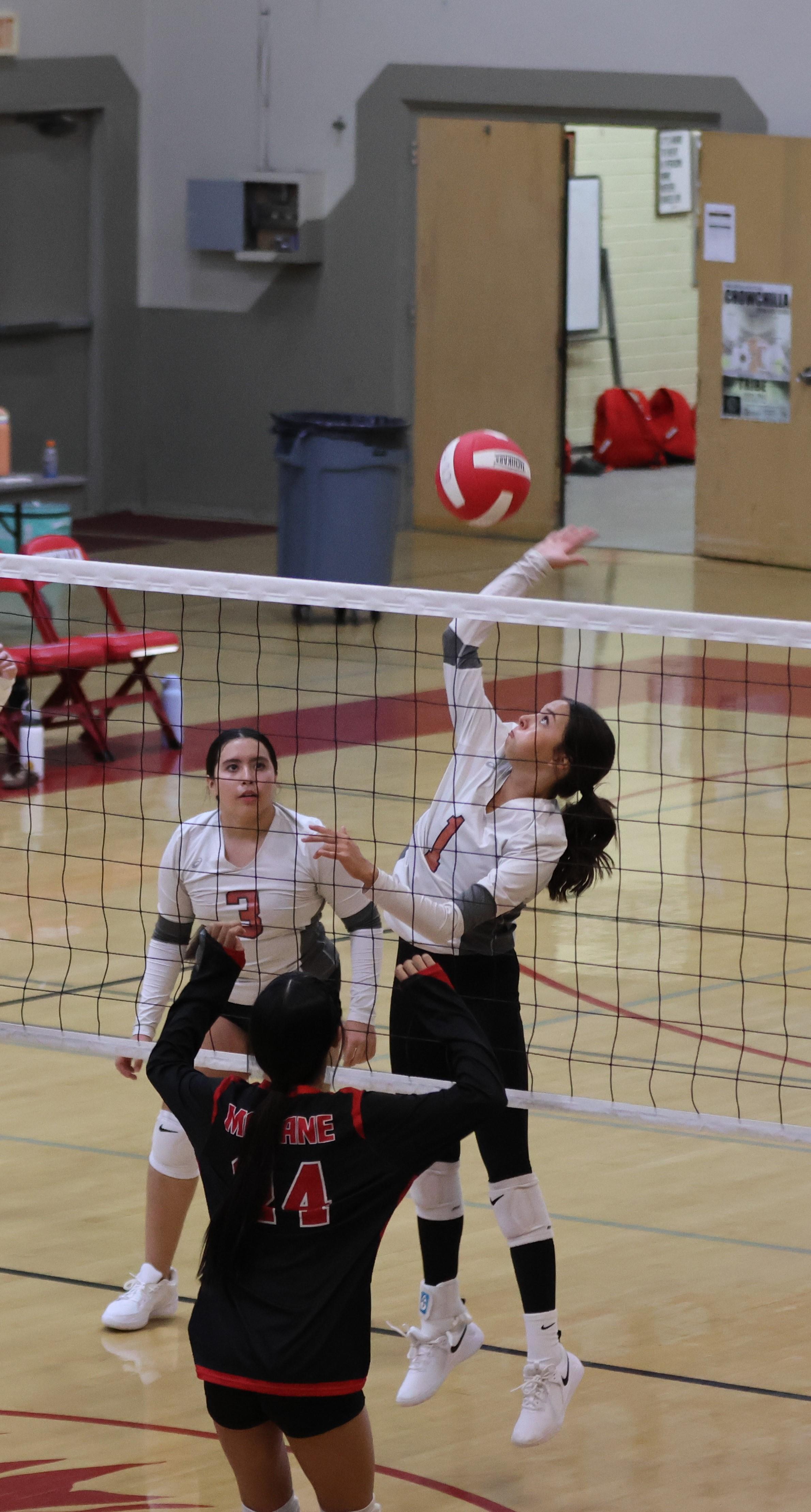 junior varsity girls playing volleyball 119
