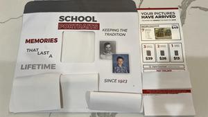 white envelope with prices for each picture package