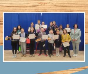 Russian students with teacher holding Russian Olympiad certificates