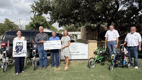Special Education Department presented the Sharing Success Grant for modified student bikes.