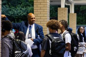 Mr Grinage meets with high school students before the first bell