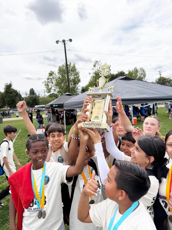 Students from Rose Salgado Elementary holding up the winners trophy