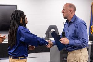 Xaiveyon presented with award by Rep. Salisbury officer