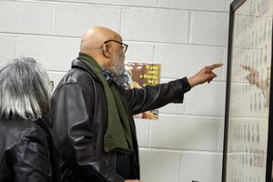 Guests look at composite photos for friends