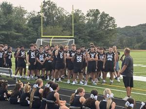 football team at pep rally
