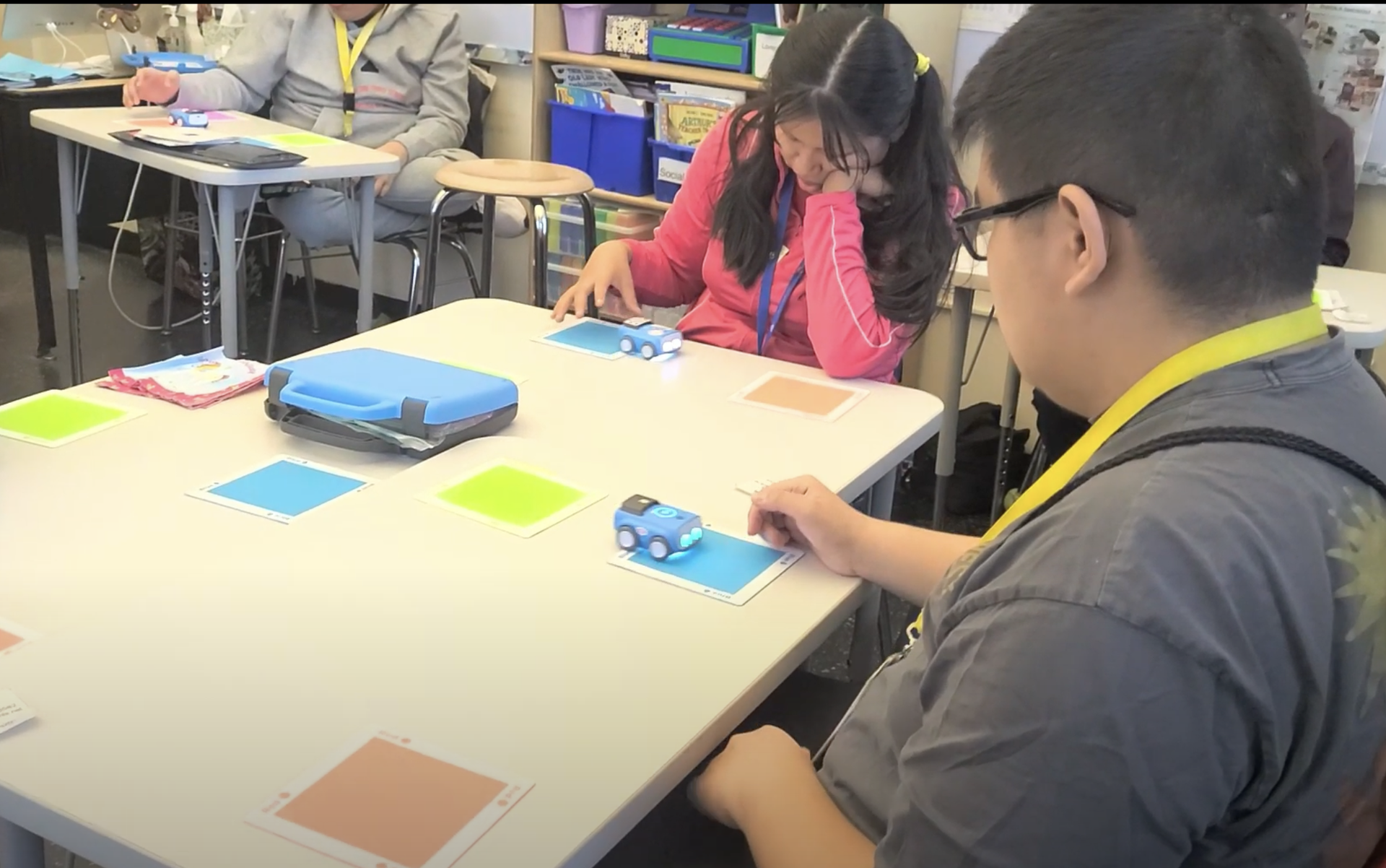 students at a table  