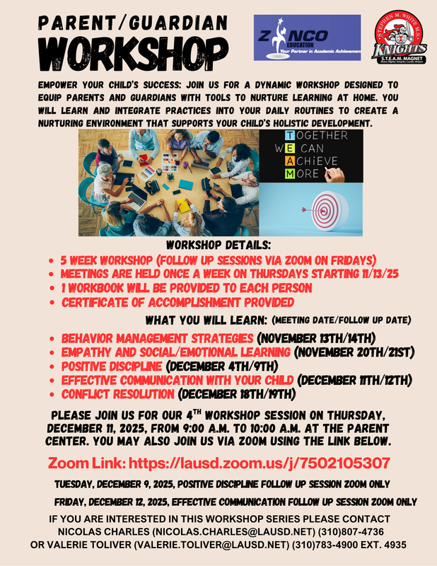 People gathered around a table with computers and tablets