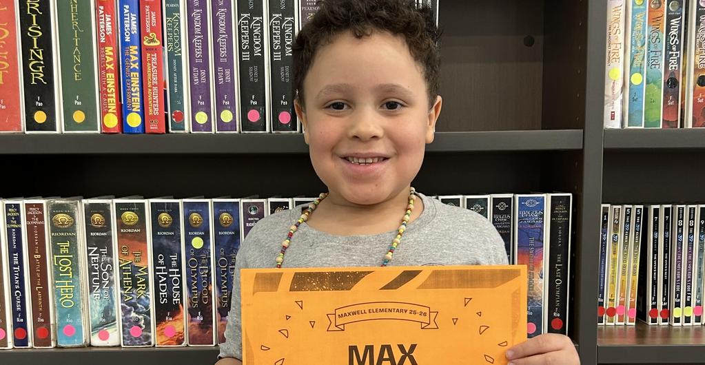 Student with reading award