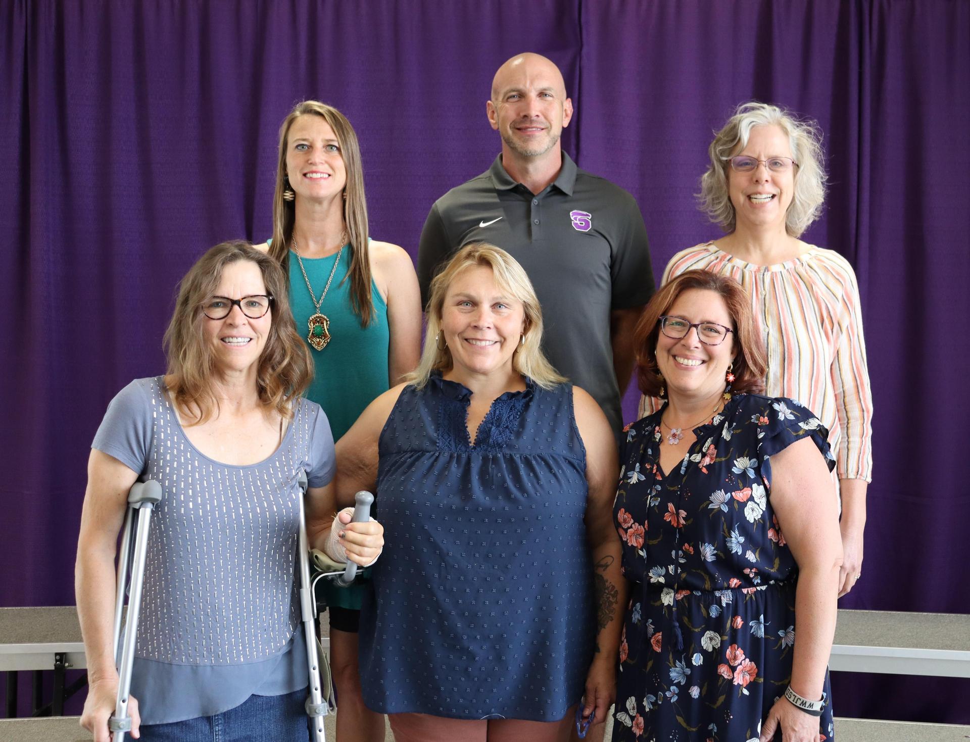 The Explore teachers smiling for a group picture.