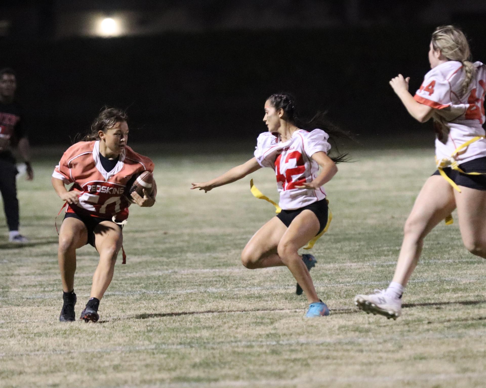 girls playing flag football