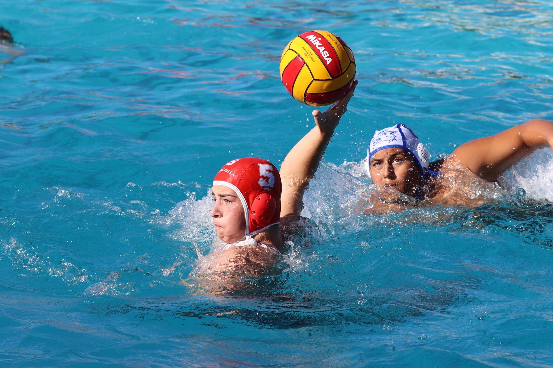boys playing water polo against Madera