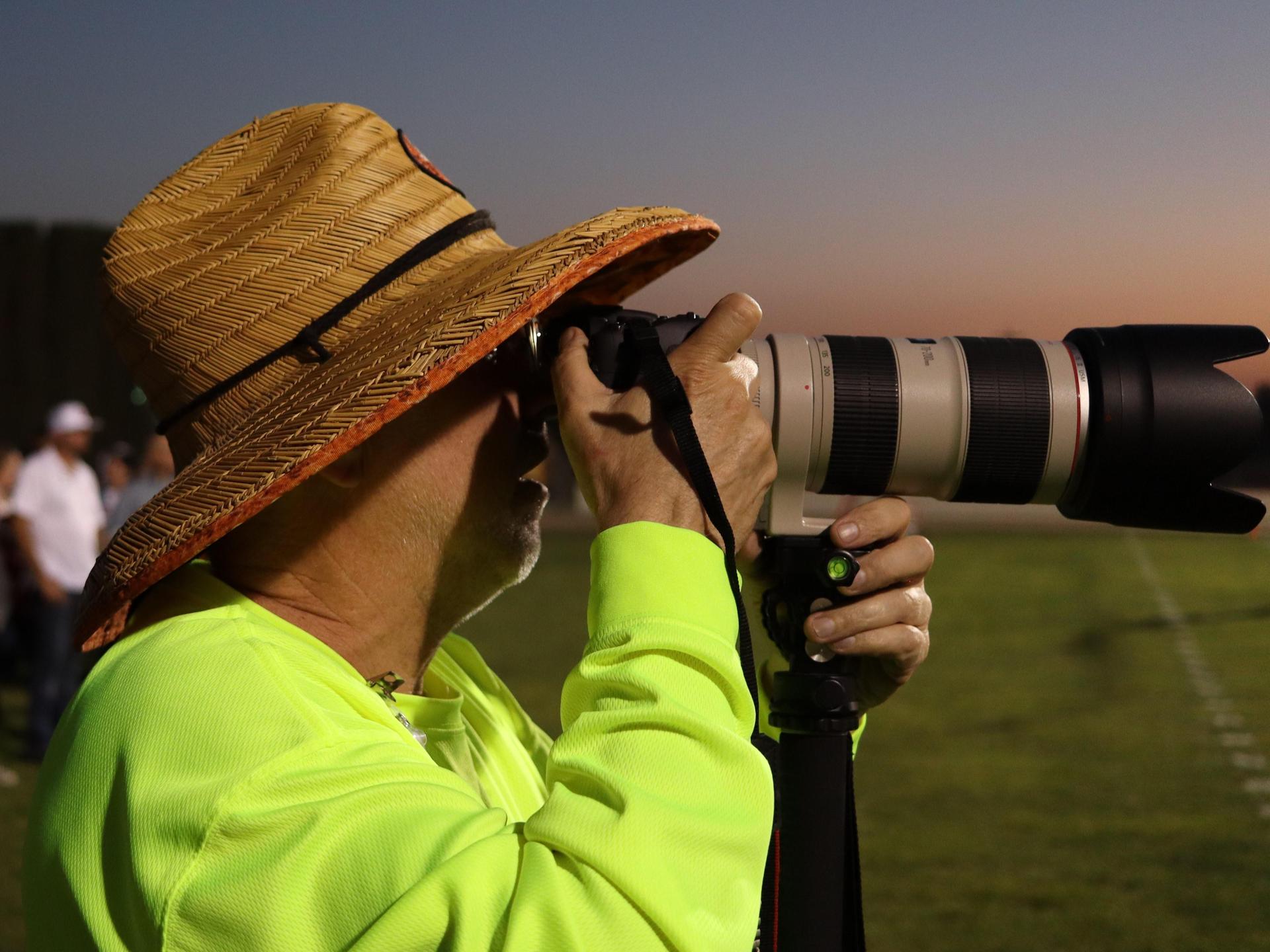 photographers in action against Caruthers