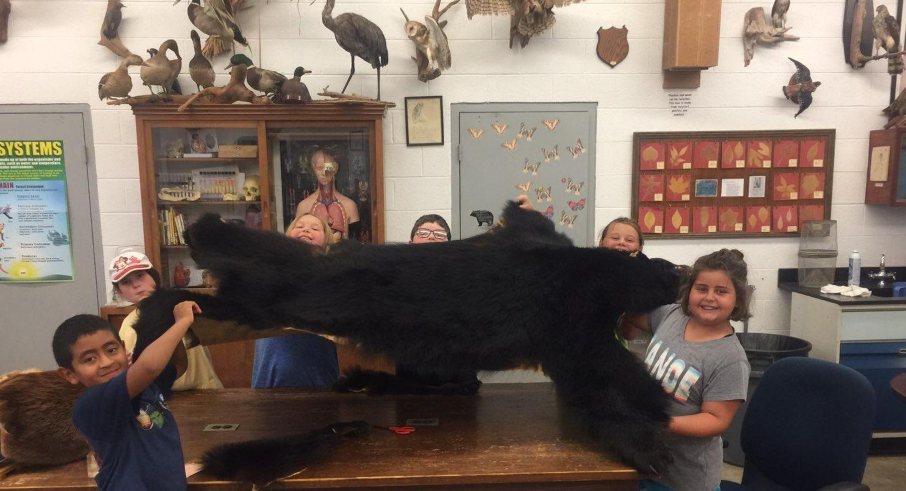 Students with bear skin.