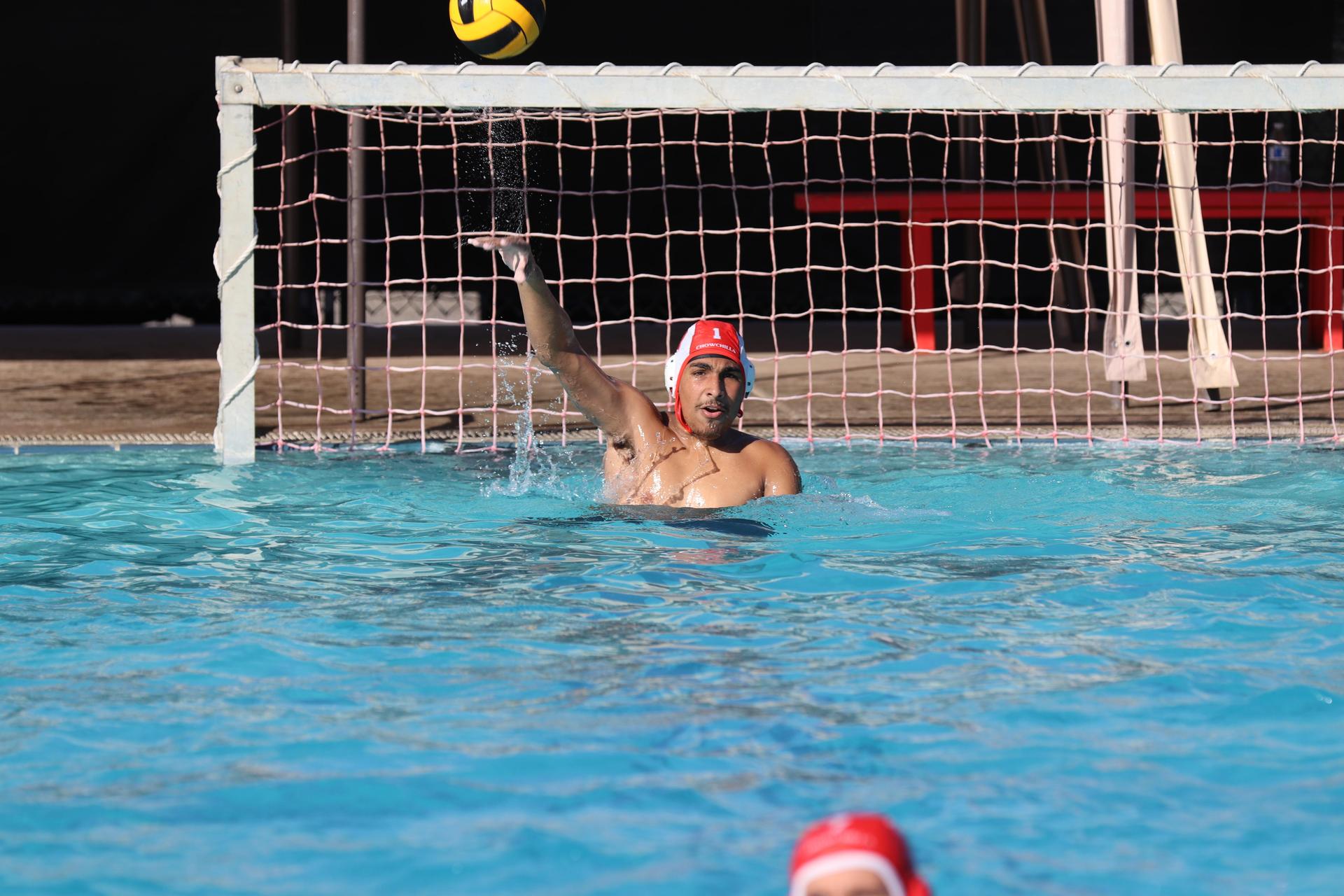 boys playing water polo against Madera
