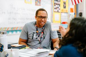 Teacher instructing a student