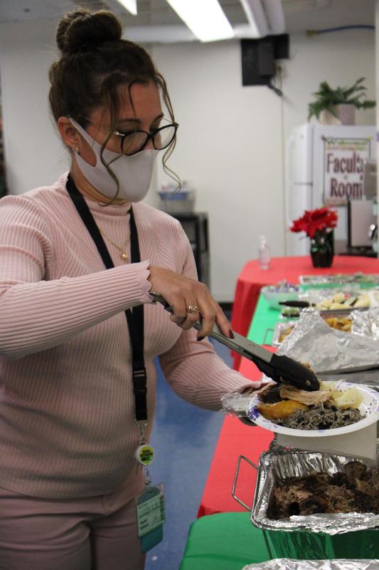 Teacher in all pink serving herself food