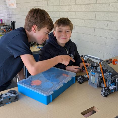students creating robotics robot