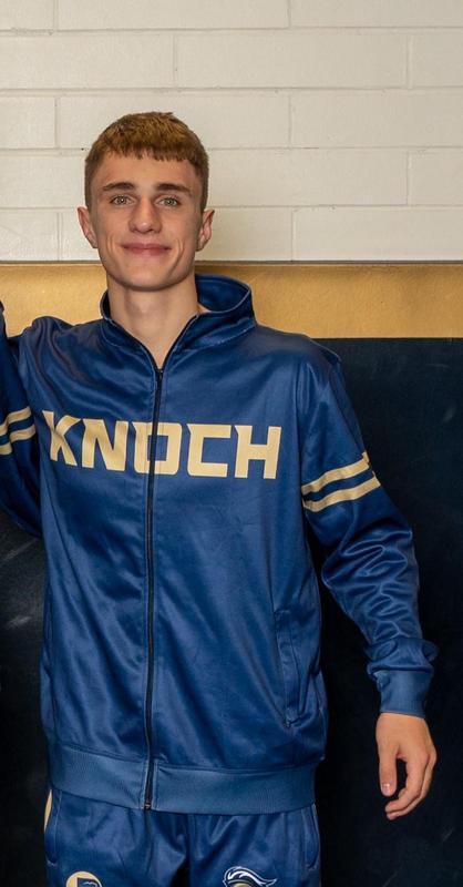senior boy wrestler smiling