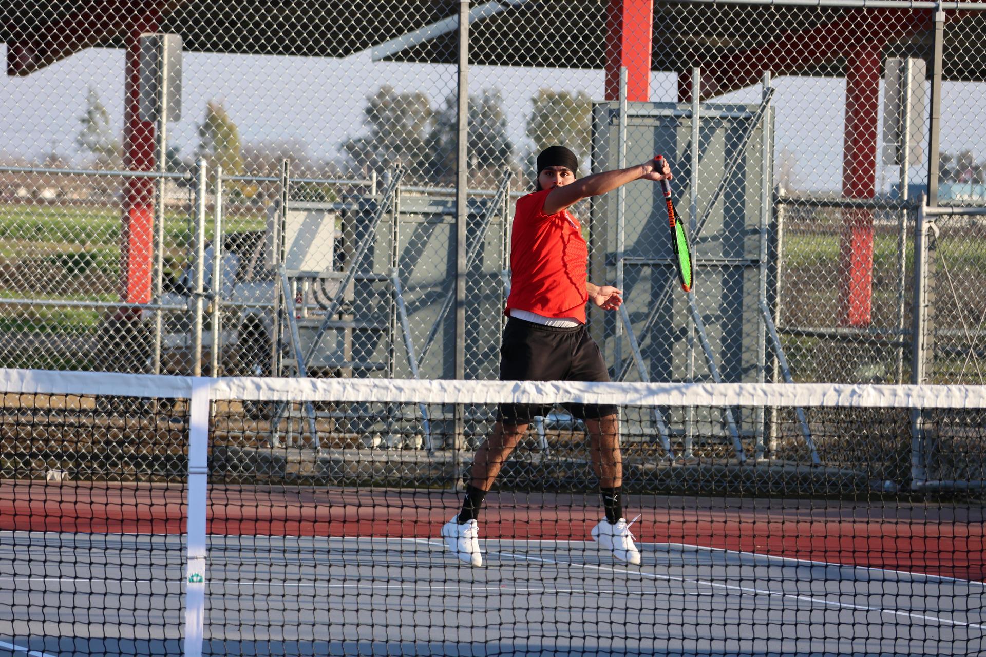 CUHS Boys playing tennis against coalinga