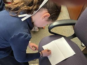 A fourth grader creates a magnetic lock.