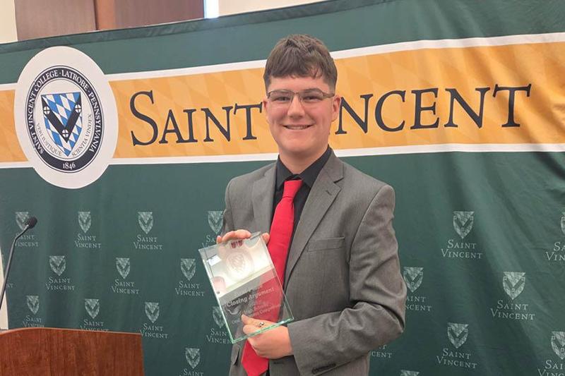 Graydon Swartz holding a certificate