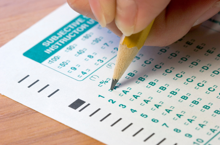 Hand holding pencil taking CMAS test