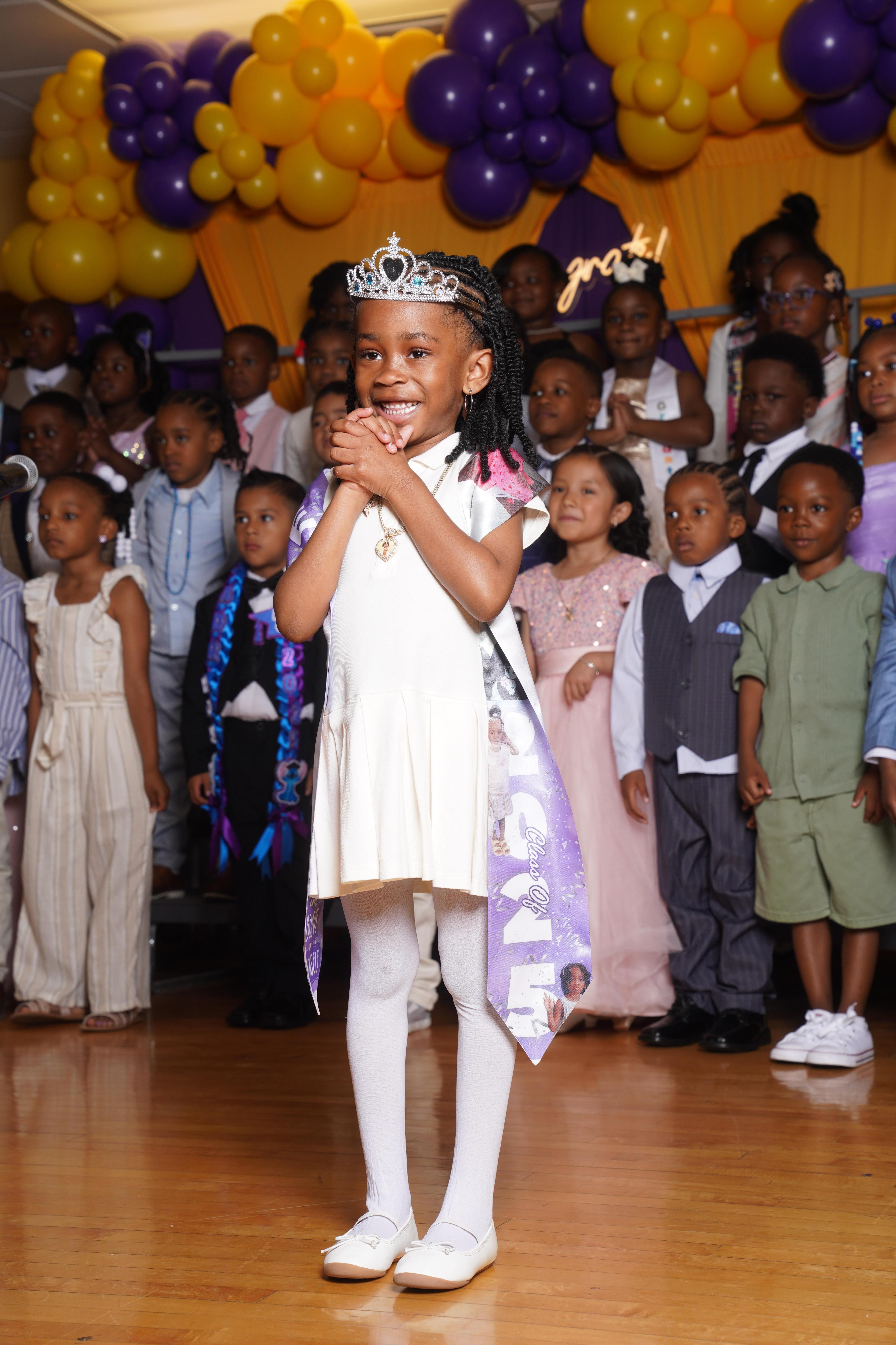 student beaming during a celebration