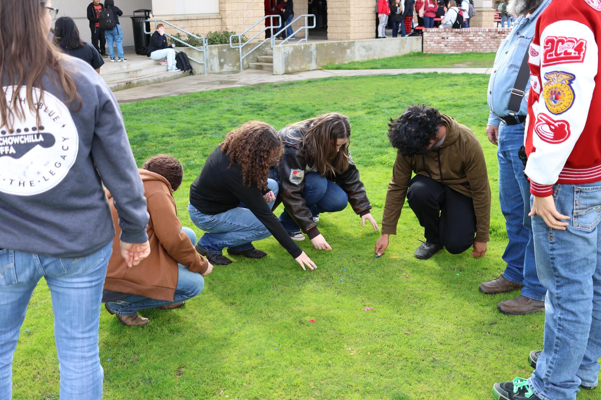 students and staff enjoying the water balloon toss