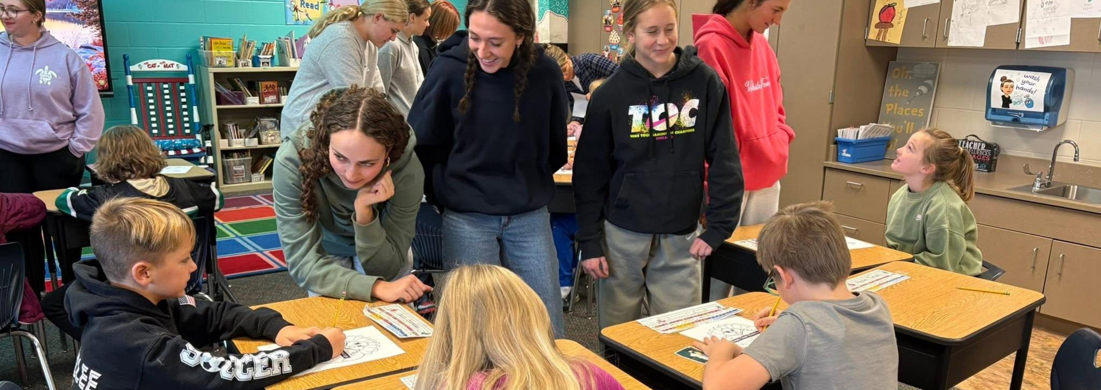 Riggs Seniors Visiting with Elementary Students