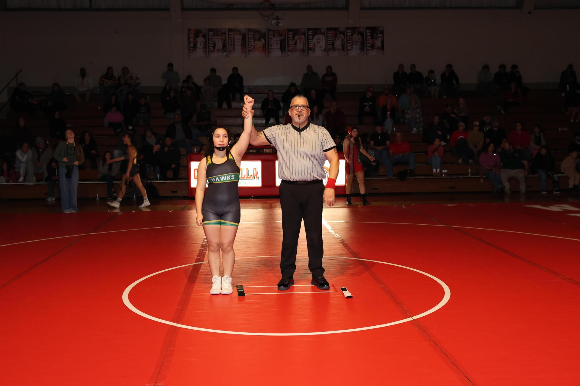Wrestling winners with hands up 103