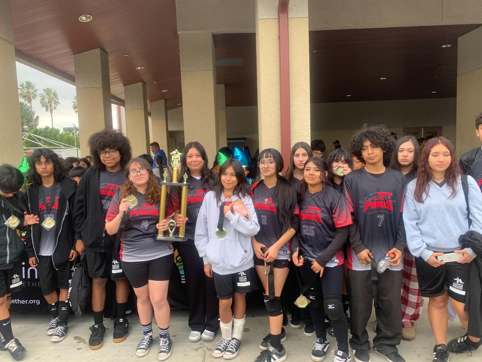 Students accept trophy at Think Together Sports event