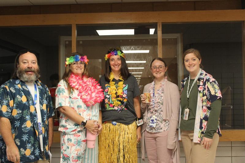 teachers dressed in Hawaiian outfits