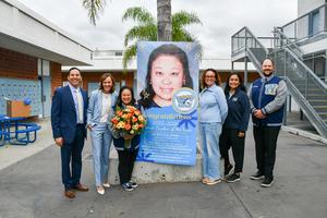 Rebecca Chai smiles for a photo with the Walnut High School leadership team during celebration.