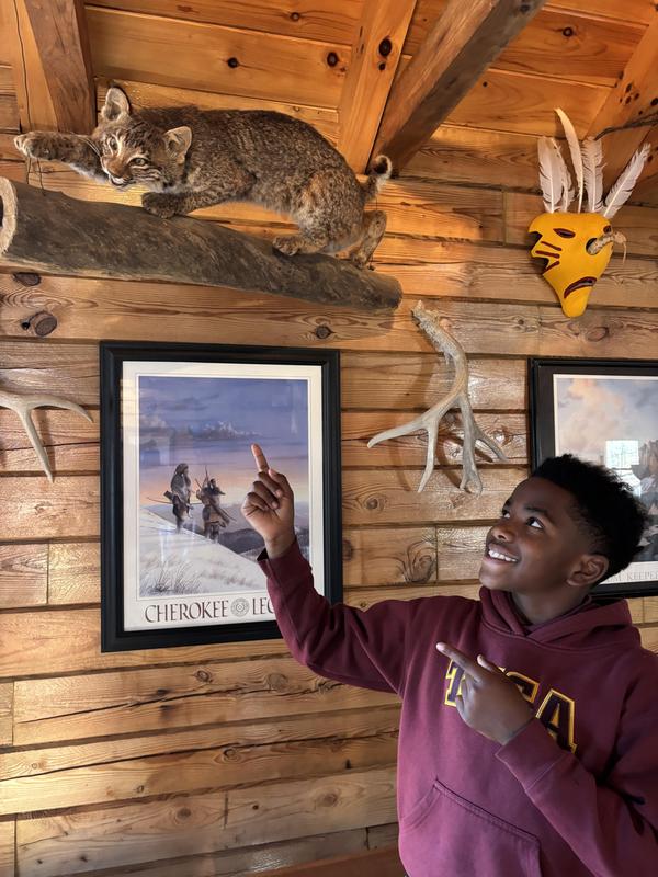 A student checking out a piece of art.