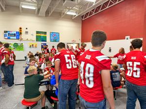 Football players and elementary lunch