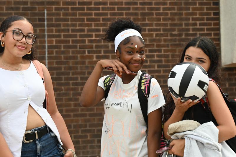 three female studetns outside on the last day of school